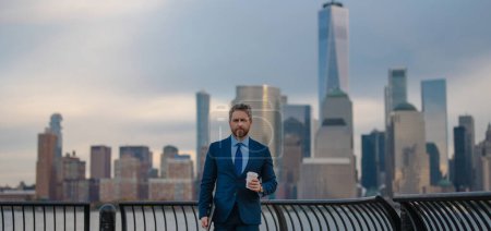 Photo for Businessman Boss. Mature businessman walk outside. Businessman walking on the street in New York. Gray businessman with beard in business suit in city street in NYC. Manager near Manhattan street - Royalty Free Image