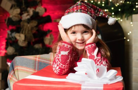 Photo for Girl baby christmas eve. Cute little child girl play near christmas tree. Kid enjoy winter holiday at home. Home filled joy and love. Cozy christmas atmosphere. Merry christmas and happy new year. - Royalty Free Image