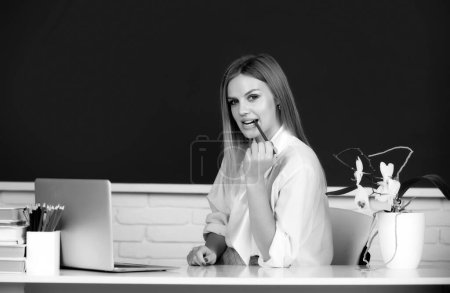 Photo for Portrait of a young, confident and attractive female student studying in school classroom. Education, high school, university, learning and people concept - Royalty Free Image