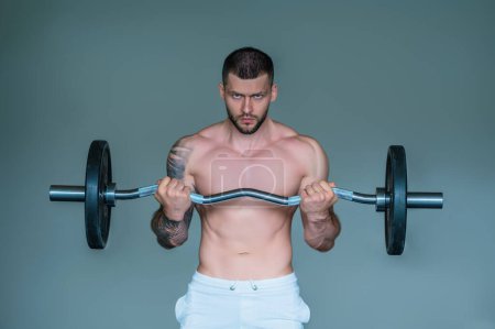 Photo for Handsome man preparing for workout. Sport. Weight workout. Guy doing bodybuilding workout in gym. Sport, bodybuilding and fitness. Man exercising with dumbbell. Hard workout - Royalty Free Image
