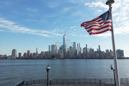 Photo for USA flag. Memorial Day, Veterans Day, 4th of July. American Flag Waving near New York City, Manhattan view. Independence Day. Labor, Flag, Patriots, President Day - Royalty Free Image