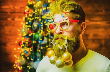 Photo for Merry Christmas and happy New Year. Hipster Santa at home. Happy new year. Bearded man in Christmas sweater - Royalty Free Image