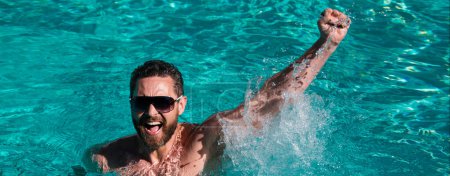 Photo for Life winner. Handsome man in swimming pool. Pool party. Summer resort. Banner for header, copy space. Poster for web design - Royalty Free Image