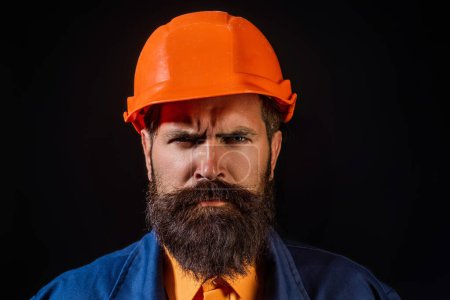 Photo for Serious bearded man in helmet. Crazy fun face of builder with Building equipment and hardhat, safety Helmet. Man in hardhat, Renovation concept. Builder and hard job. Construction man, contractor - Royalty Free Image