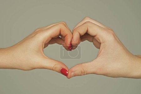 Photo for Heart from hands. Love, friendship concept. Man and woman hand in heart form love. Sign heart by fingers. Love on Valentine day. Two human hold hand gesturing heart shape symbol. Love sign. Charity - Royalty Free Image