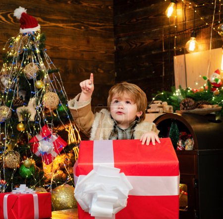 Photo for Happy child with Christmas gift. Happy kid having fun with big gift box. Christmas decorations. Wish you merry Christmas - Royalty Free Image