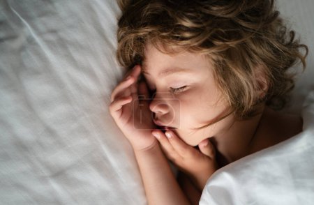 Photo for Deep sleep kids. Cute sleeping Child in bed. little angel dreams - Royalty Free Image