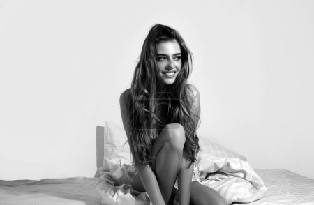 Photo for Young woman on bedroom. Funny girl in bed enjoying her morning and wake up - Royalty Free Image