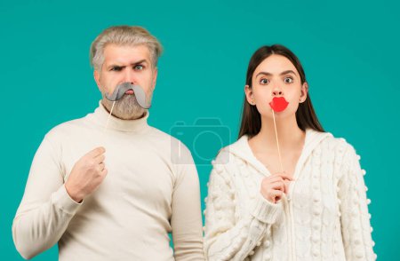 Photo for Couple with with fake mustache and lips. Having fun. Photo booth concept. Couple having fun with with fake mustache and lips - Royalty Free Image