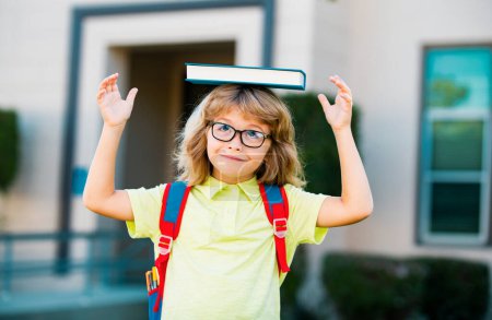 Photo for School child boy at school. Schoolboy going back to school - Royalty Free Image
