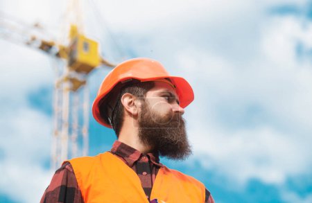 Foto de Portrait of worker man at construction site. Building and construction site concept - Imagen libre de derechos