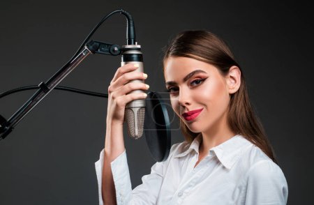Photo for Young woman singing with a music microphone - Royalty Free Image