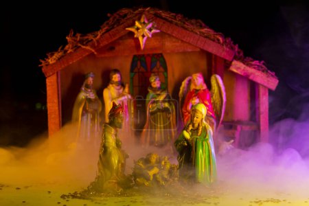 Photo for Christmas decorative creche with Holy family. Religious Christmas scene of baby Jesus in the manger with Joseph, Mary and shepherd. Bible Magi found Jesus. Christian bible character - Royalty Free Image