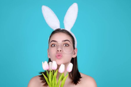 Photo for Easter girl. Young woman with bunny ears and Easter eggs on studio background. Festive bunny and easter eggs season. Stylish woman in Easter bunny ears isolated on studio background - Royalty Free Image