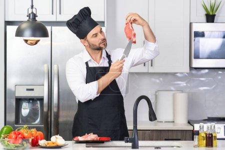 Photo for Chef cook in a cuisine with vegetables in kitchen. Healthy cooking. Attractive caucasian man cooking in the kitchen. Guy cooking healthy meal in modern kitchen. Chef preparing cuisine dish on kitchen - Royalty Free Image