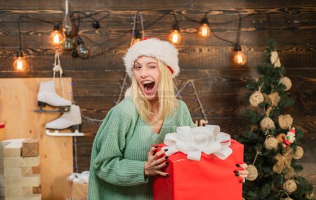 Photo for Crazy comical face. Comic grimace. Positive human emotions facial expressions. Smiling woman decorating Christmas tree at home. Having fun. Surprise concept. Expressions face - Royalty Free Image