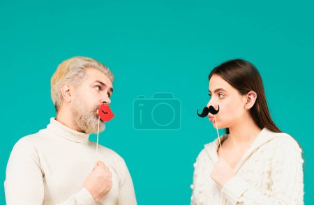 Téléchargez les photos : Gender concept. Female and male sex icon. Funny couple of woman with moustache and man with red lips. Identity transgender, gender stereotypes - en image libre de droit