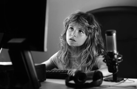Photo for Cute preschool child watching video lesson by laptop. Little hacker, young programmer - Royalty Free Image