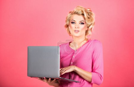 Foto de Beauty woman using laptop computer isolated background. Sexy secretary - Imagen libre de derechos