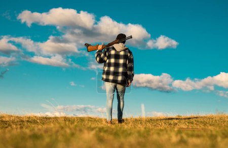Photo for Hunter with shotgun gun on hunt. Closed and open hunting season - Royalty Free Image