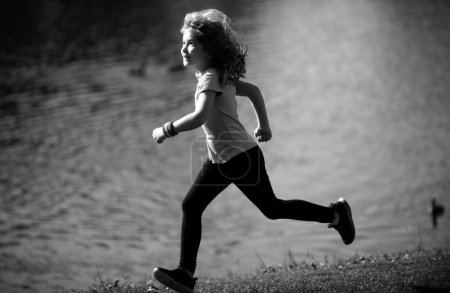 Photo for Kids running outdoors. Child runner jogger running in the nature. Morning jogging. Active healthy kids lifestyle. Morning running with children - Royalty Free Image