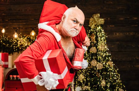 Photo for Thief Santa with bag on christmas background. Thief stole new years presents. Christmas safety from burglars and home security - Royalty Free Image