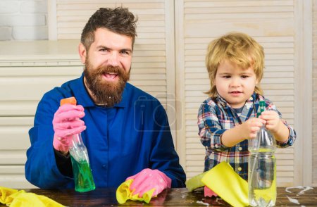 Photo for Family time concept. Dad with son and cleaning supplies. Father and kid having fun during cleaning. Man with child plays with soapsuds - Royalty Free Image