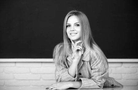Photo for Portrait of smiling young college student studying in classroom. Positive emotions of cute school girl - Royalty Free Image