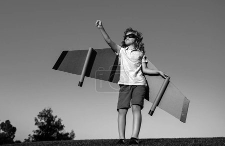 Photo for Kid superhero with jetpack. Child pilot play on summer day. Success, leader and winner concept. Imagination and freedom. Vacation trip over blue sky - Royalty Free Image