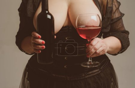Photo for Naked woman with wine bottle and glasses. Plus size sexy fashion model, fat woman with big natural breast. Women with big naked breasts boobs. Wine festival - Royalty Free Image