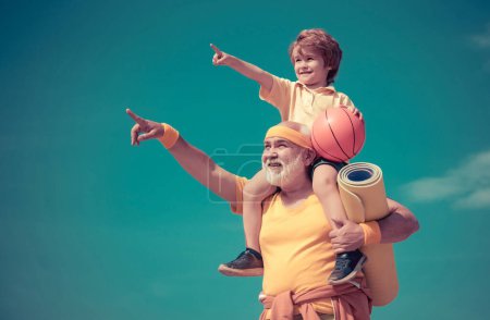 Photo for Fitness and active lifestyle concept - copy space. Active family enjoy sport and fitness. Sport exercise for kids. Grandfather helping child exercising - Royalty Free Image