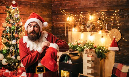 Photo for Christmas stockings. Christmas people celebration New Year. Portrait of a brutal mature Santa Claus - Royalty Free Image