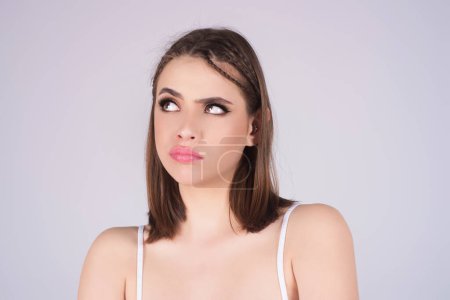 Photo for Woman with hand on chin thinking about question, pensive expression. Thoughtful female face. Doubt thinks. Thoughtful pensive girl. Human face expressions, feeling emotions. Skeptical expression - Royalty Free Image