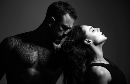 Photo for Lovely sexy couple in love. Man embrace sensual woman. Fashion and beauty, romantic guy and girl. Romantic couples embraces. Sexy elegant couple in the tender passion. Beautiful woman near the man - Royalty Free Image