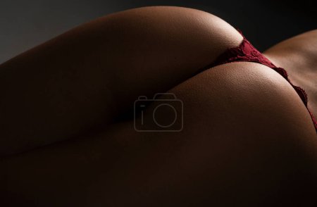 Photo for Sexy big ass in erotic lingerie closeup. Great ass. Sexy female wearing pants. Sexual girl takes off underwear. Seductive woman with beautiful butt, undressed and stripper concept - Royalty Free Image