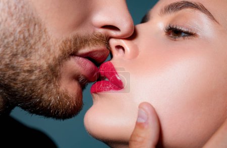 Photo for Close-up of beautiful passionate couple kissing. Young lovers closing to kiss. Woman smelling mans perfumes. Sexy Aroma. Sensual kisses. Profile side view, cropped macro of face - Royalty Free Image
