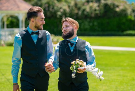 Photo for Gay marriage. Gay couple wedding. Holidays, Festivals, and Events lgbt concept. Lgbt gay marriage couple having romantic moment together on wedding ceremony holding hands. Concept of LGBTQ - Royalty Free Image