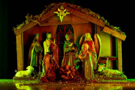 Photo for Christmas nativity scene. Christmas creche with Joseph Mary and Jesus. Christmas Manger scene with figurines including Jesus, Mary, Joseph, sheep and magi - Royalty Free Image