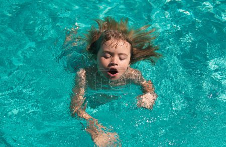Photo for Kid in swimming pool. Boy Practice Swimming - Royalty Free Image