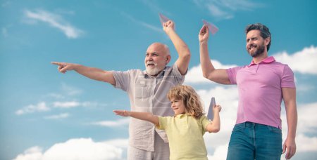 Photo for Fathers day. Kid having fun with toy plane. Men generation family with three different generations ages grandfather father and son. Weekend family play - Royalty Free Image