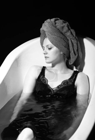 Photo for Depression concept. Sad woman in bath. Sadness, fatigue or grief, frustration. Alone upset girl - Royalty Free Image