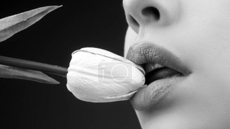 Photo for Sexy lips with tulips. Oral sex, licking flower. Blowjob and kiss. Sensual sexy female mouth and spring flowers - Royalty Free Image