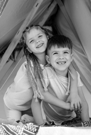 Photo for Kids family. Happy sister and brother embrace. Hugs and love - Royalty Free Image