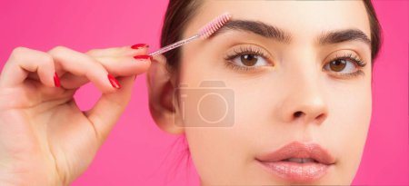 Photo for Perfect eyebrows. Close up of woman getting eyebrow make-up. Macro applying cosmetics on her eyebrow with brush. Perfect shape of eyebrow, brown eyeshadows and long eyelashes. Beauty concept - Royalty Free Image