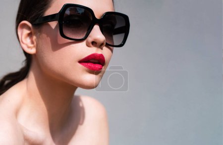 Photo for Sunglasses advertising. Closeup girl with sun glasses. Fashion trendy style woman. Beautiful female model - Royalty Free Image