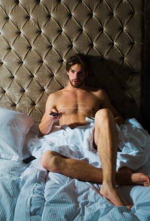 Photo for Shirtless man gay laying on the bed - Royalty Free Image
