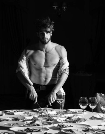 Photo for Man at restaurant. Diet guy with bare torso, choice between healthy and unhealthy food. Shirtless man food delicious. Assorted food on table. Dinner gourmet cuisine catering food concept - Royalty Free Image