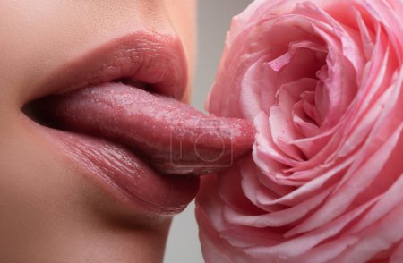 Photo for Lips with lipstick closeup. Cosmetology, drugstore or fashion makeup concept. Beauty studio shot. Passionate kiss. Beautiful woman lips with rose - Royalty Free Image