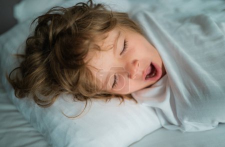 Photo for Kids morning wake up. Close-up portrait of sleeping child - Royalty Free Image