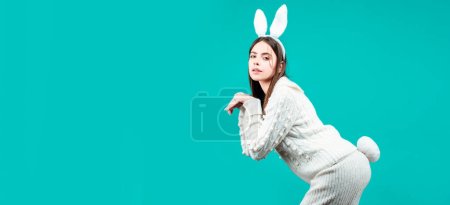 Photo for Easter banner with bunny woman. Funny girl with Easter bunny ears on Easter card on isolated background - Royalty Free Image
